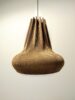 Hanglamp karton Paper-Glow Corona 55. Deze duurzame designlamp van gerecycled karton wordt voor u volledig met de hand gemaakt. Hierdoor is elke lamp uniek.
